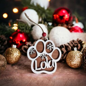 Custom Dog Paw Ornament made on reclaimed barn wood on a tree